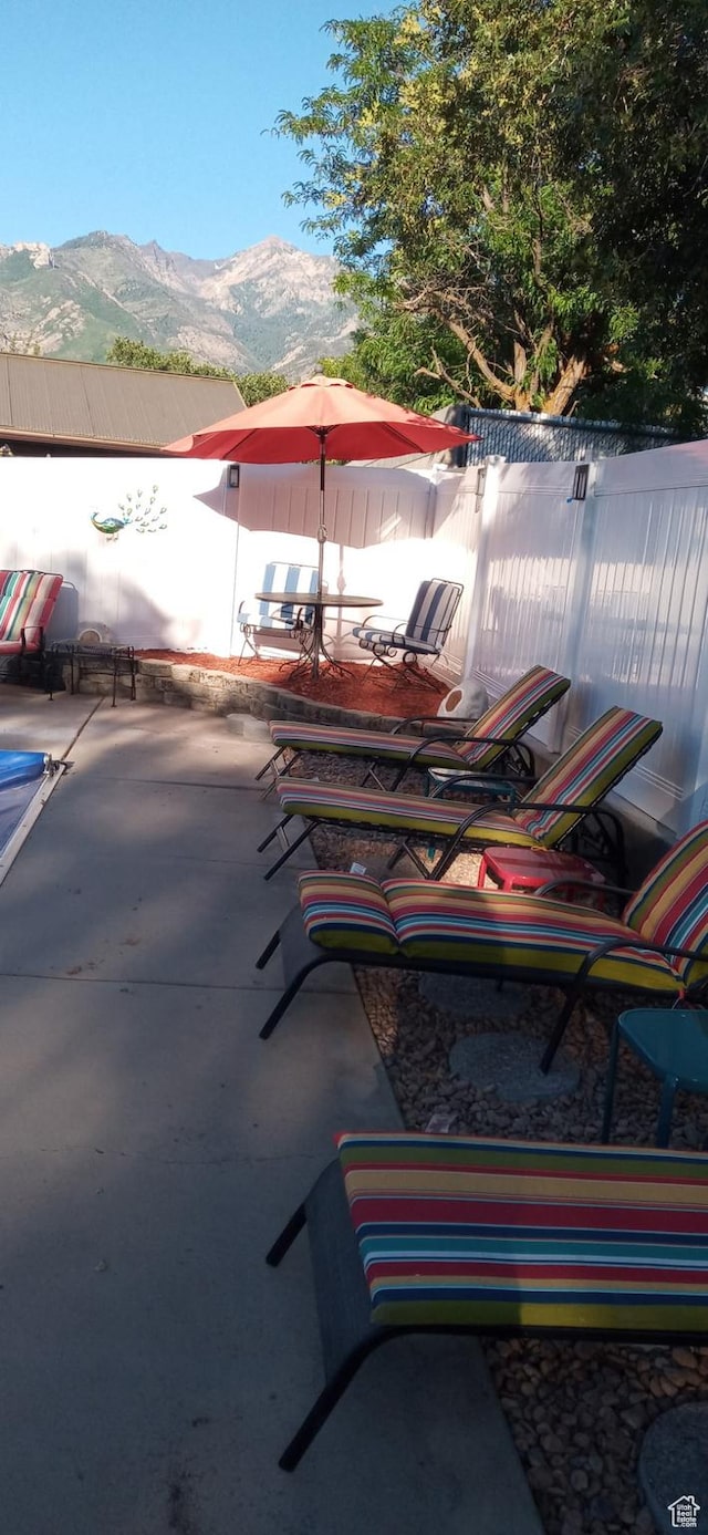 view of patio / terrace featuring a mountain view