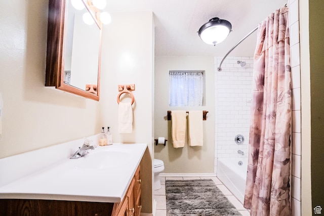 full bathroom with tile patterned floors, toilet, vanity, and shower / tub combo