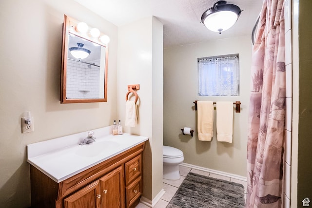 bathroom with curtained shower, toilet, vanity, and tile patterned flooring