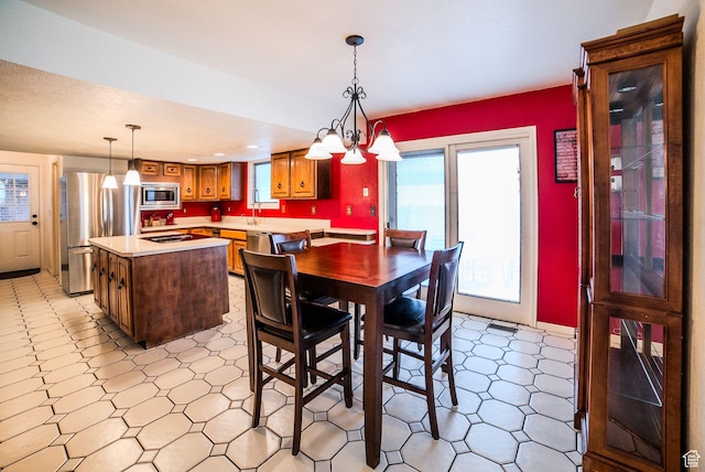 dining room featuring sink