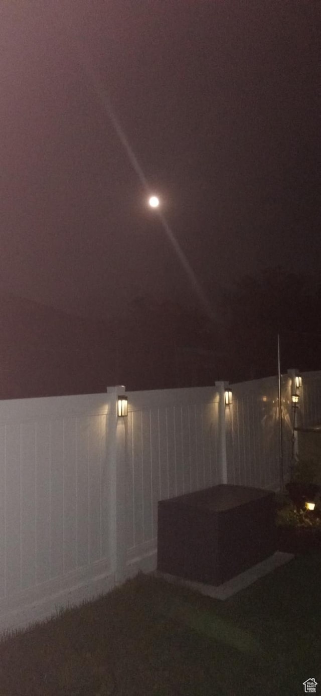 view of yard at twilight