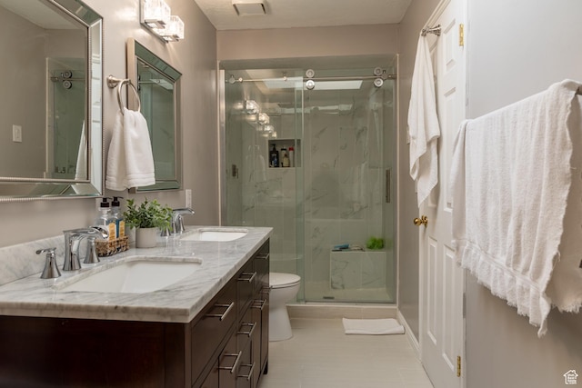 1158 E 650 N, Ogden, UT 84404 - bathroom featuring a marble finish shower, double vanity, toilet, and tile patterned floors
