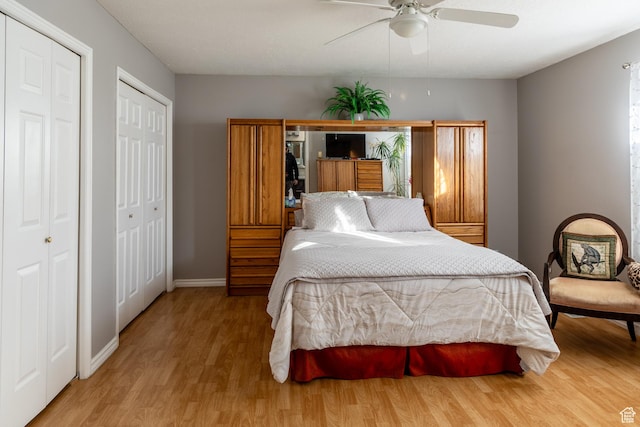 1158 E 650 N, Ogden, UT 84404 - bedroom with wood finished floors, multiple closets, baseboards, and a ceiling fan