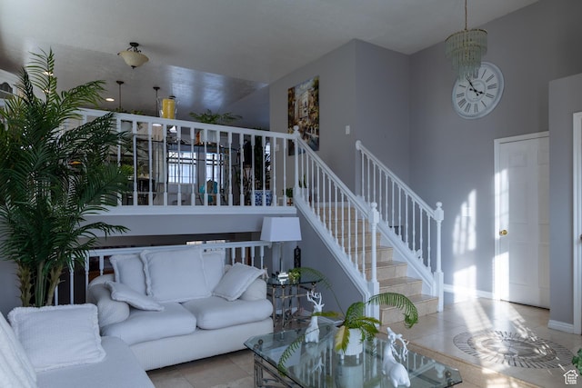 1158 E 650 N, Ogden, UT 84404 - tiled living room featuring a high ceiling, stairway, a chandelier, and healthy amount of natural light