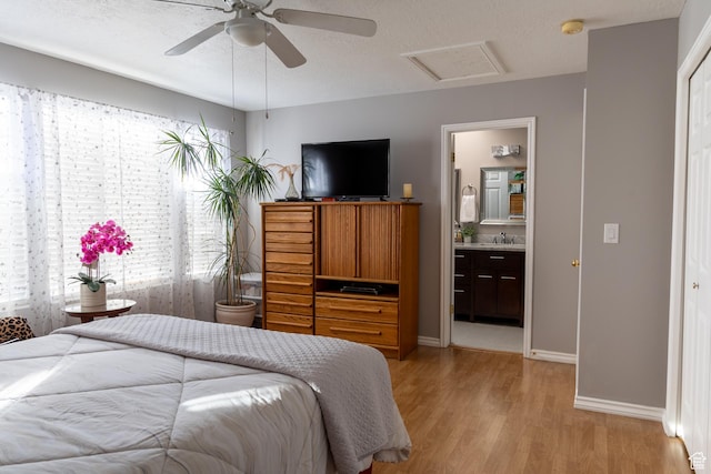 1158 E 650 N, Ogden, UT 84404 - bedroom with attic access, light wood-type flooring, baseboards, a sink, and connected bathroom