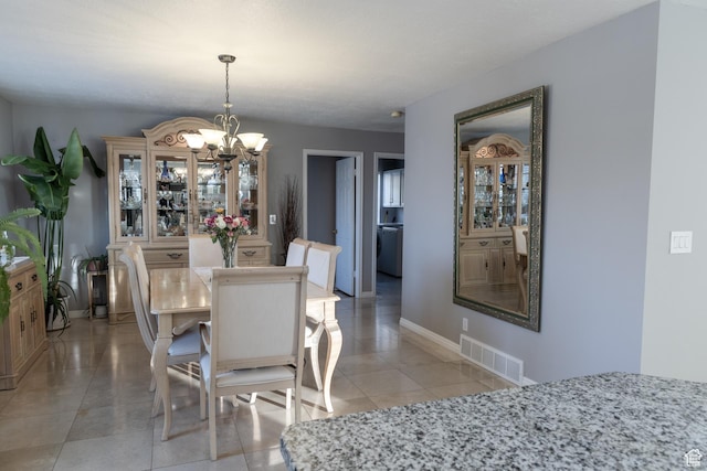 1158 E 650 N, Ogden, UT 84404 - dining space featuring a chandelier, baseboards, and light tile patterned floors