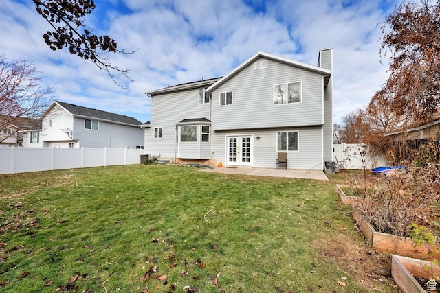 538 E 1200 S, Kaysville, UT 84037 - back of house featuring french doors, a patio, and a lawn