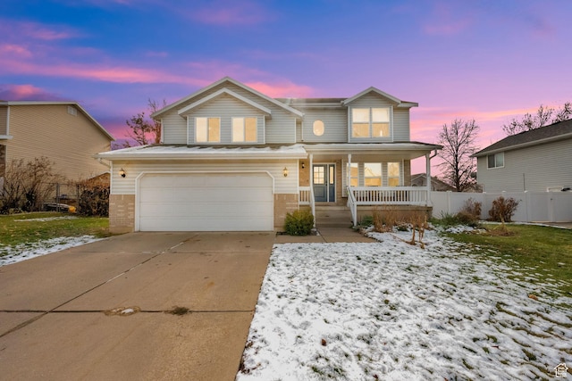 front facade featuring a porch and a garage