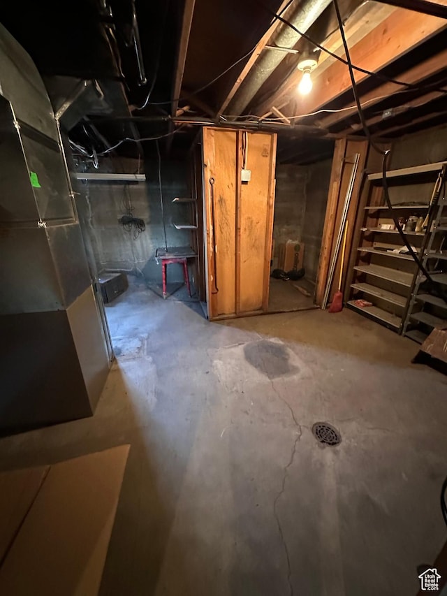 unfinished basement with heating unit