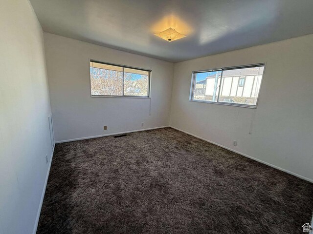 885 N 600 E, Price, UT 84501 - spare room featuring baseboards and carpet flooring