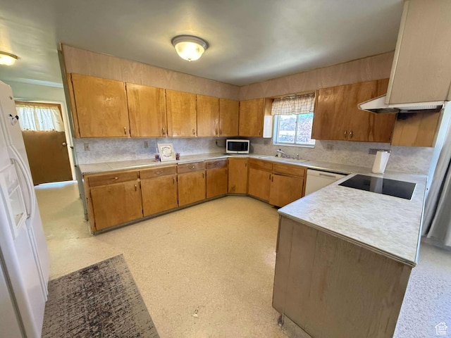 885 N 600 E, Price, UT 84501 - kitchen featuring white appliances, light countertops, decorative backsplash, and brown cabinets
