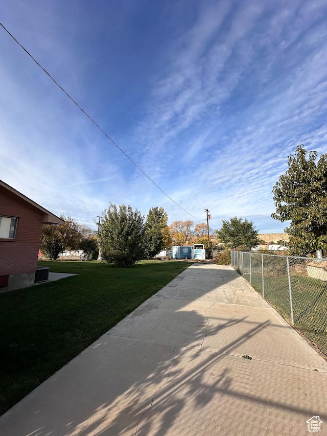 exterior space featuring fence and a yard