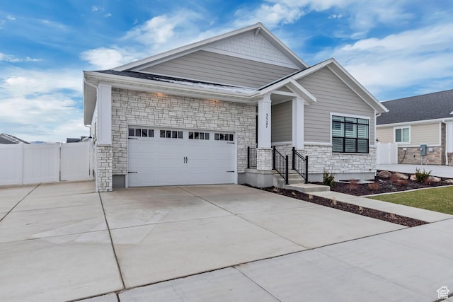 3527 W Haven Aire, South Jordan, UT 84095 - craftsman-style home with a gate, stone siding, concrete driveway, an attached garage, and fence