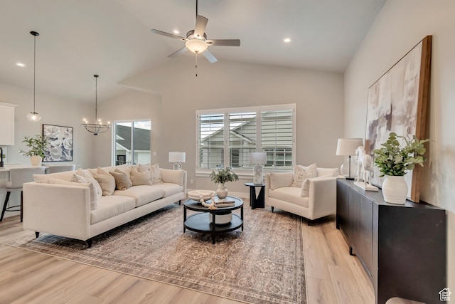 3527 W Haven Aire, South Jordan, UT 84095 - living room with lofted ceiling, light wood-type flooring, recessed lighting, and ceiling fan with notable chandelier