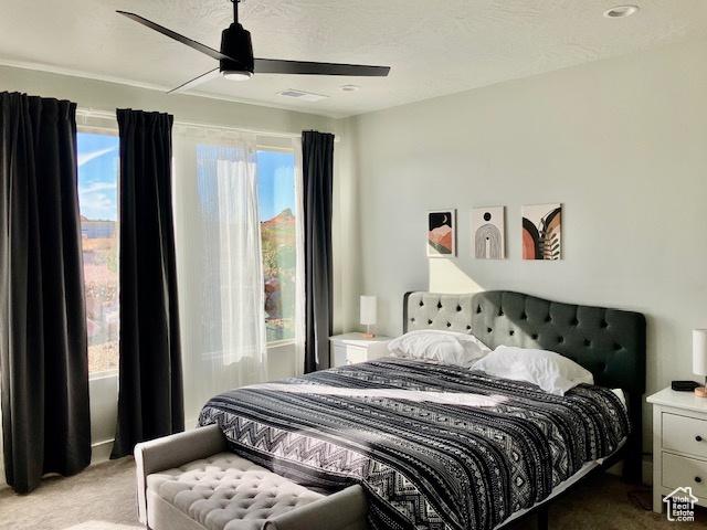 3260 Retreat Dr S, Hurricane, UT 84737 - carpeted bedroom featuring ceiling fan and a textured ceiling