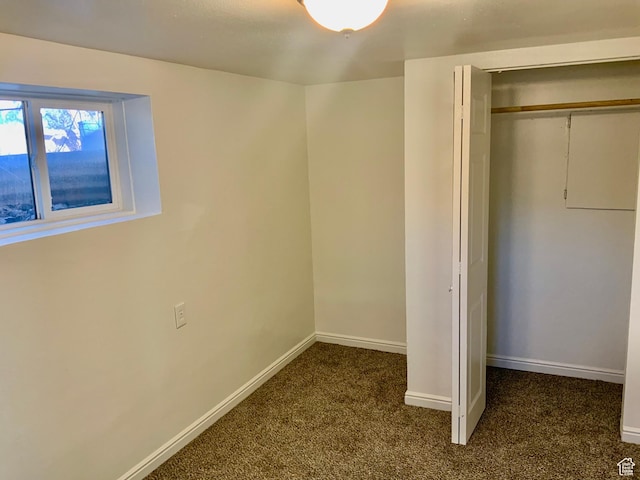 250 W 700 S, Richfield, UT 84701 - unfurnished bedroom with a closet and dark colored carpet