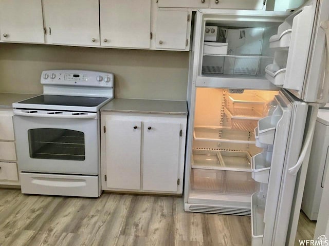 250 W 700 S, Richfield, UT 84701 - kitchen with white electric range oven, white cabinets, refrigerator, and light wood-type flooring