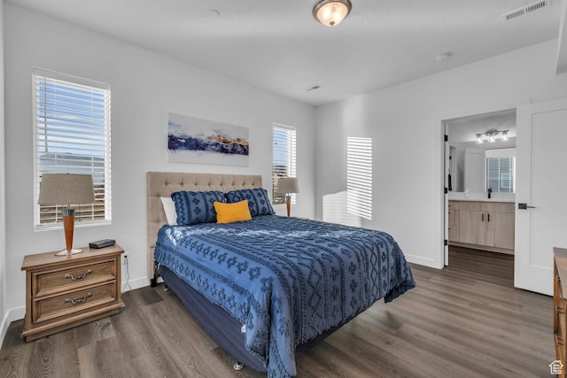 1218 Sawmill Blvd Unit 104, Heber City, UT 84032 - bedroom featuring ensuite bathroom, dark hardwood / wood-style flooring, and sink