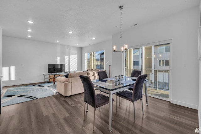 1218 Sawmill Blvd Unit 104, Heber City, UT 84032 - dining space with dark hardwood / wood-style floors, a textured ceiling, and an inviting chandelier