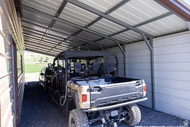 view of vehicle parking featuring a carport