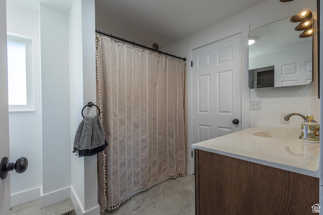 bathroom featuring tile patterned floors, vanity, and a shower with shower curtain