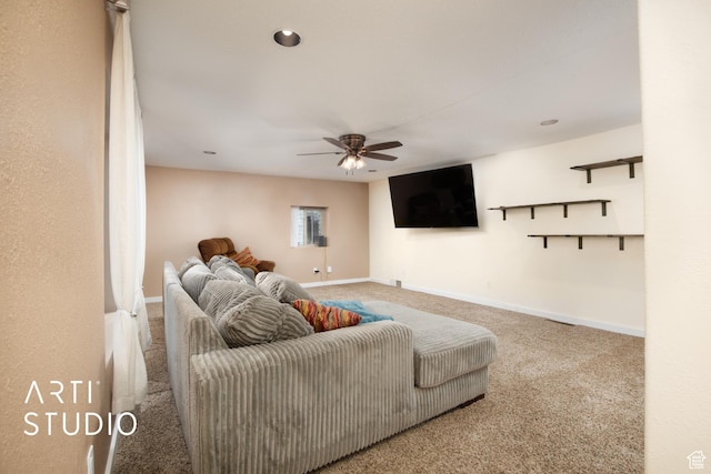 living room featuring carpet flooring and ceiling fan