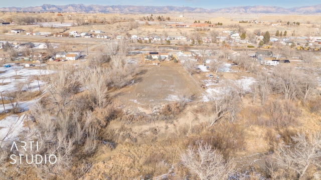 birds eye view of property featuring a mountain view