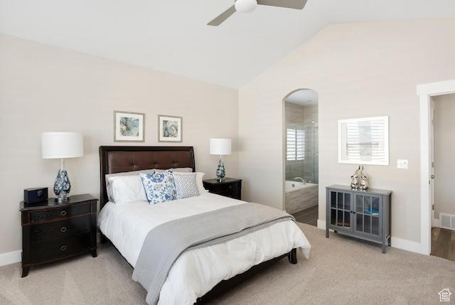 carpeted bedroom featuring ensuite bathroom, ceiling fan, and lofted ceiling