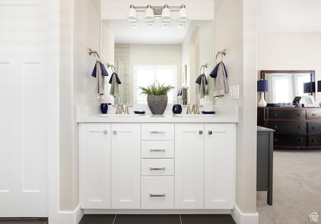 5129 N Cambridge Way, Stansbury Park, UT 84074 - full bath featuring double vanity and healthy amount of natural light