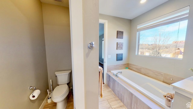 668 W 0470 N, Moab, UT 84532 - bathroom featuring tiled tub and toilet