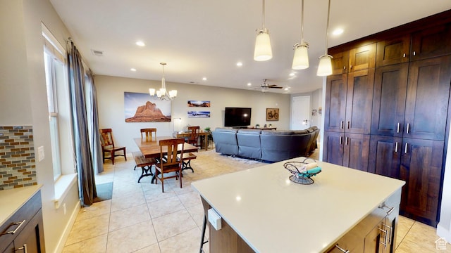 668 W 0470 N, Moab, UT 84532 - kitchen featuring light countertops, light tile patterned floors, recessed lighting, hanging light fixtures, and a chandelier