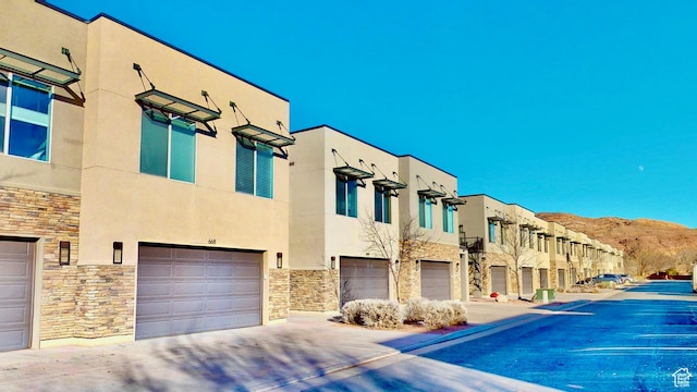 exterior space featuring a mountain view and a garage
