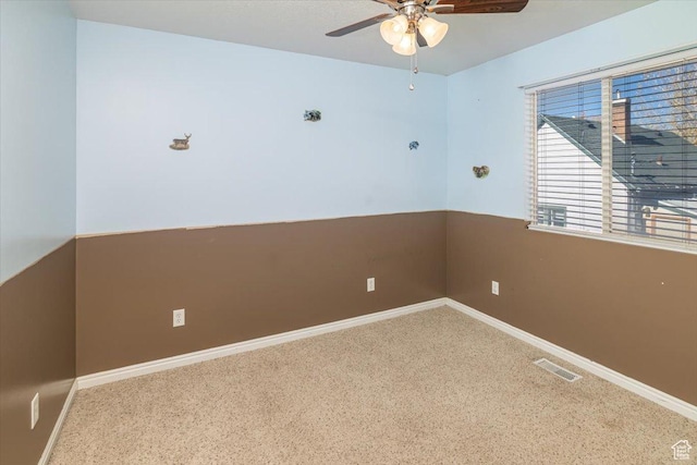 empty room with carpet and ceiling fan
