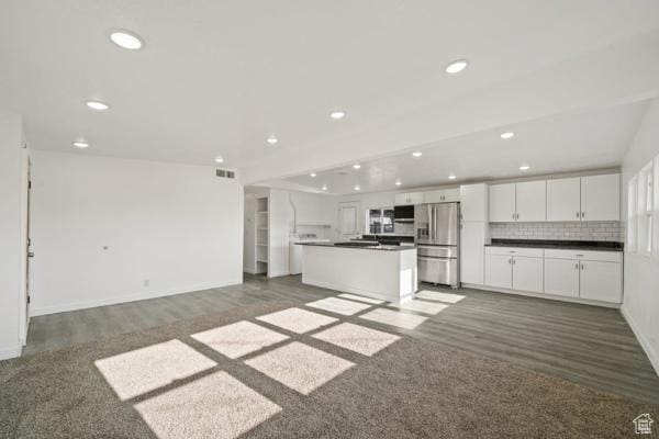 756 E 3rd St S, Ogden, UT 84404 - kitchen featuring white cabinetry, open floor plan, stainless steel refrigerator with ice dispenser, backsplash, and dark countertops