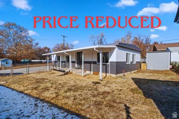758 E 3rd St S, Ogden, UT 84404 - view of front of house featuring covered porch and board and batten siding