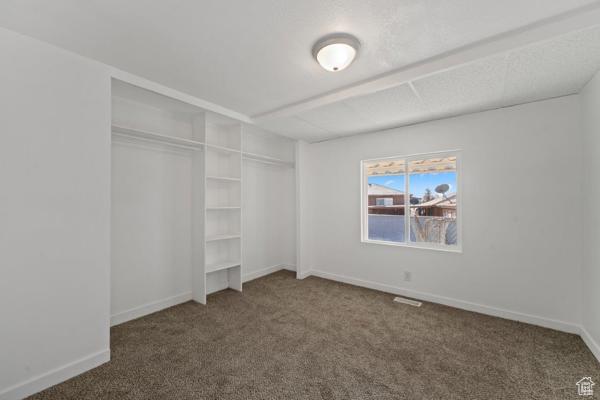 758 E 3rd St S, Ogden, UT 84404 - unfurnished bedroom with carpet, a closet, and baseboards