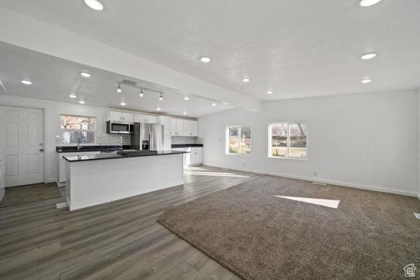 758 E 3rd St S, Ogden, UT 84404 - kitchen featuring appliances with stainless steel finishes, white cabinets, recessed lighting, baseboards, and dark countertops