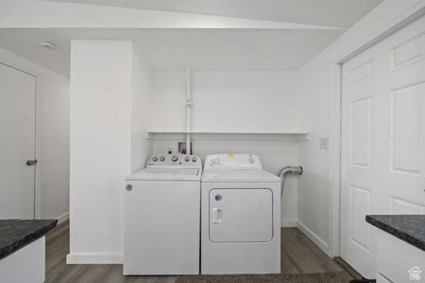 758 E 3rd St S, Ogden, UT 84404 - laundry area with dark wood finished floors, washer and clothes dryer, and baseboards