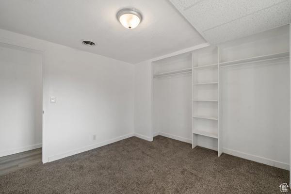 758 E 3rd St S, Ogden, UT 84404 - unfurnished bedroom featuring carpet, a closet, and baseboards