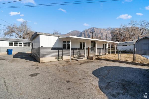 758 E 3rd St S, Ogden, UT 84404 - view of front of house with a mountain view, covered porch, and a gate