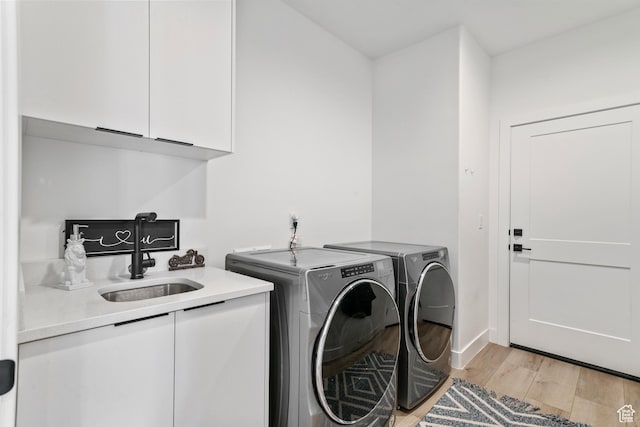 1823 W 180 N Street N, Hurricane, UT 84737 - clothes washing area featuring cabinets, light hardwood / wood-style floors, washing machine and clothes dryer, and sink