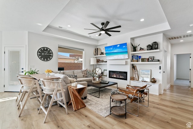1823 W 180 N Street N, Hurricane, UT 84737 - living room featuring ceiling fan, a raised ceiling, and light wood-type flooring