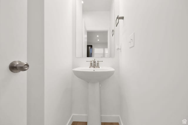 bathroom featuring hardwood / wood-style flooring and sink
