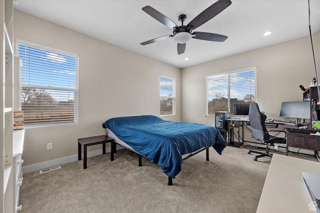 carpeted bedroom with ceiling fan