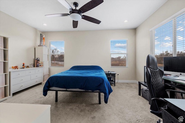 carpeted bedroom with ceiling fan