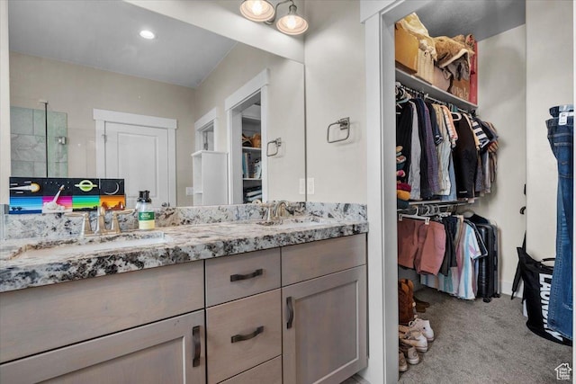 bathroom with vanity and walk in shower