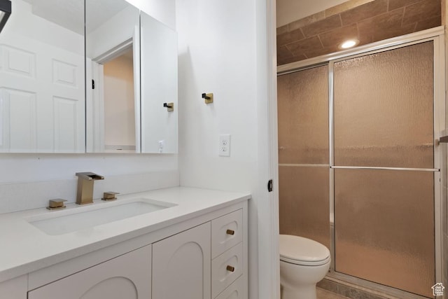 12875 S Aspen Cir, Riverton, UT 84065 - bathroom featuring vanity, toilet, and a shower with door
