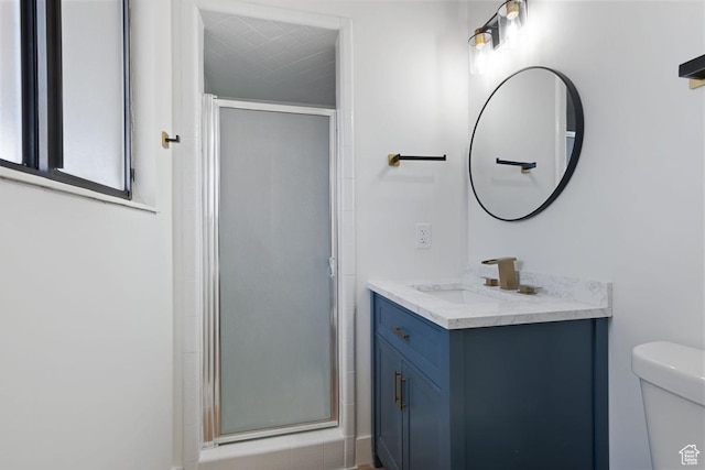 12875 S Aspen Cir, Riverton, UT 84065 - bathroom with vanity, toilet, and an enclosed shower