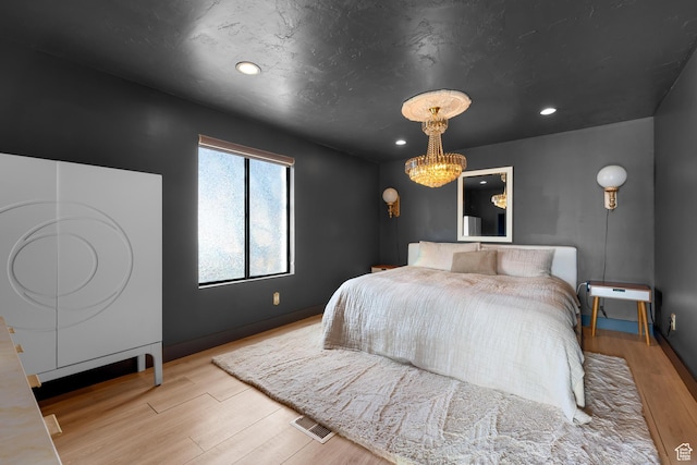 837 E 930 N, Pleasant Grove, UT 84062 - bedroom with light hardwood / wood-style floors and a notable chandelier
