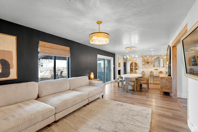 837 E 930 N, Pleasant Grove, UT 84062 - living room featuring light hardwood / wood-style floors and a notable chandelier